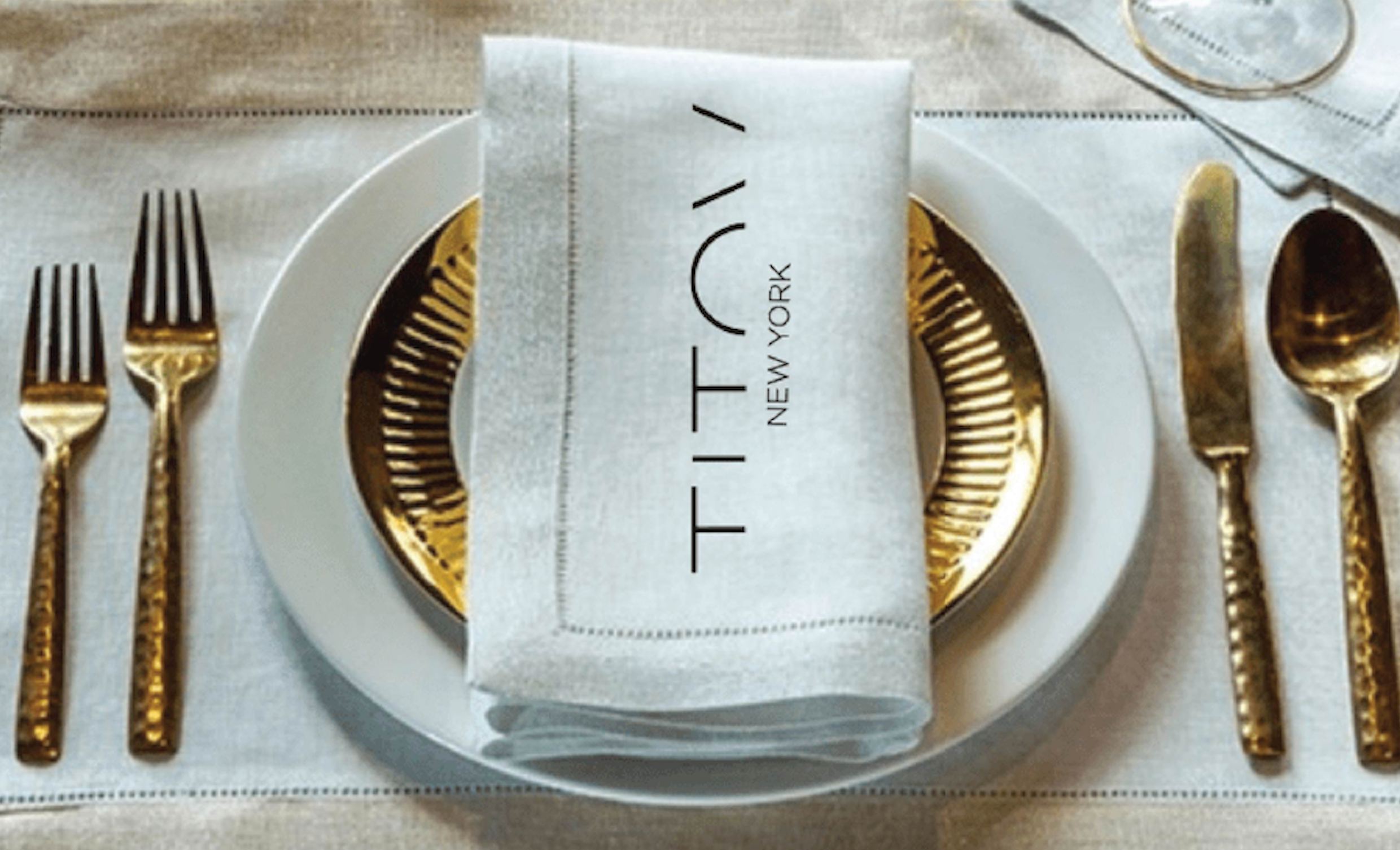 Luxury dinner table setting for lingerie brand party event gold silverware