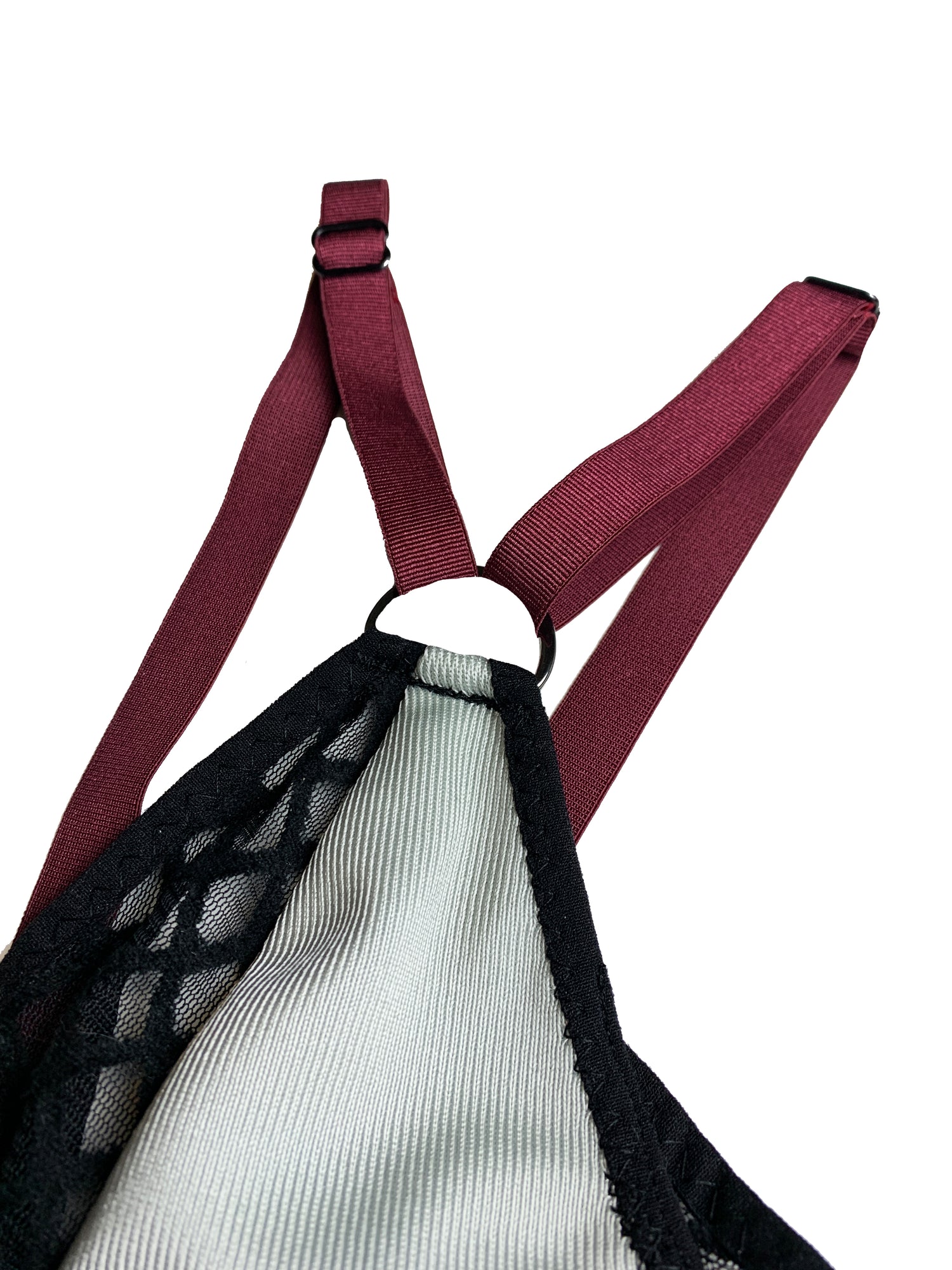 detailing of a bralette with gray, black, and deep purple coloring
