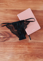 Black lace thong with notebook