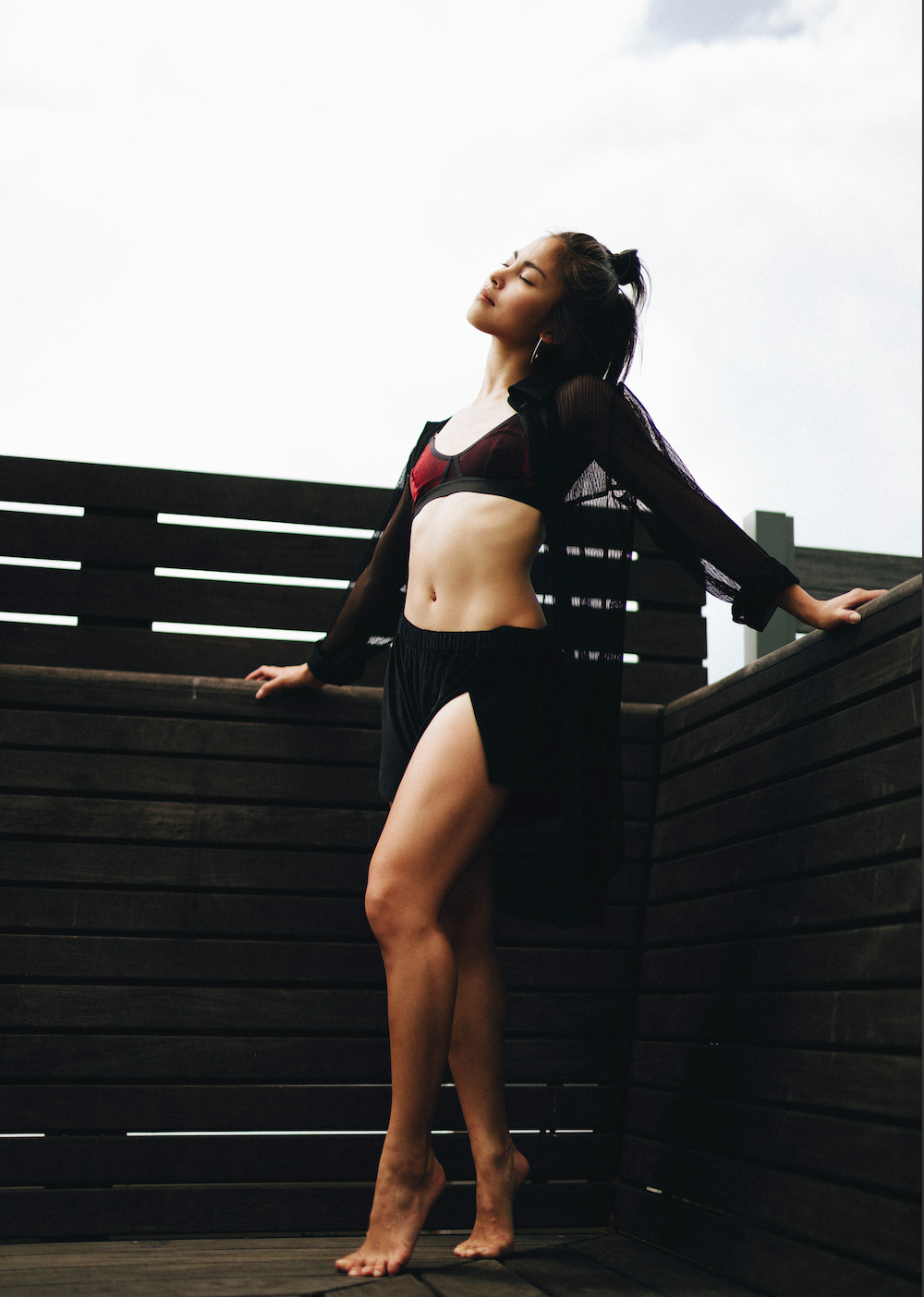 Side view of glossy metallic red bralette