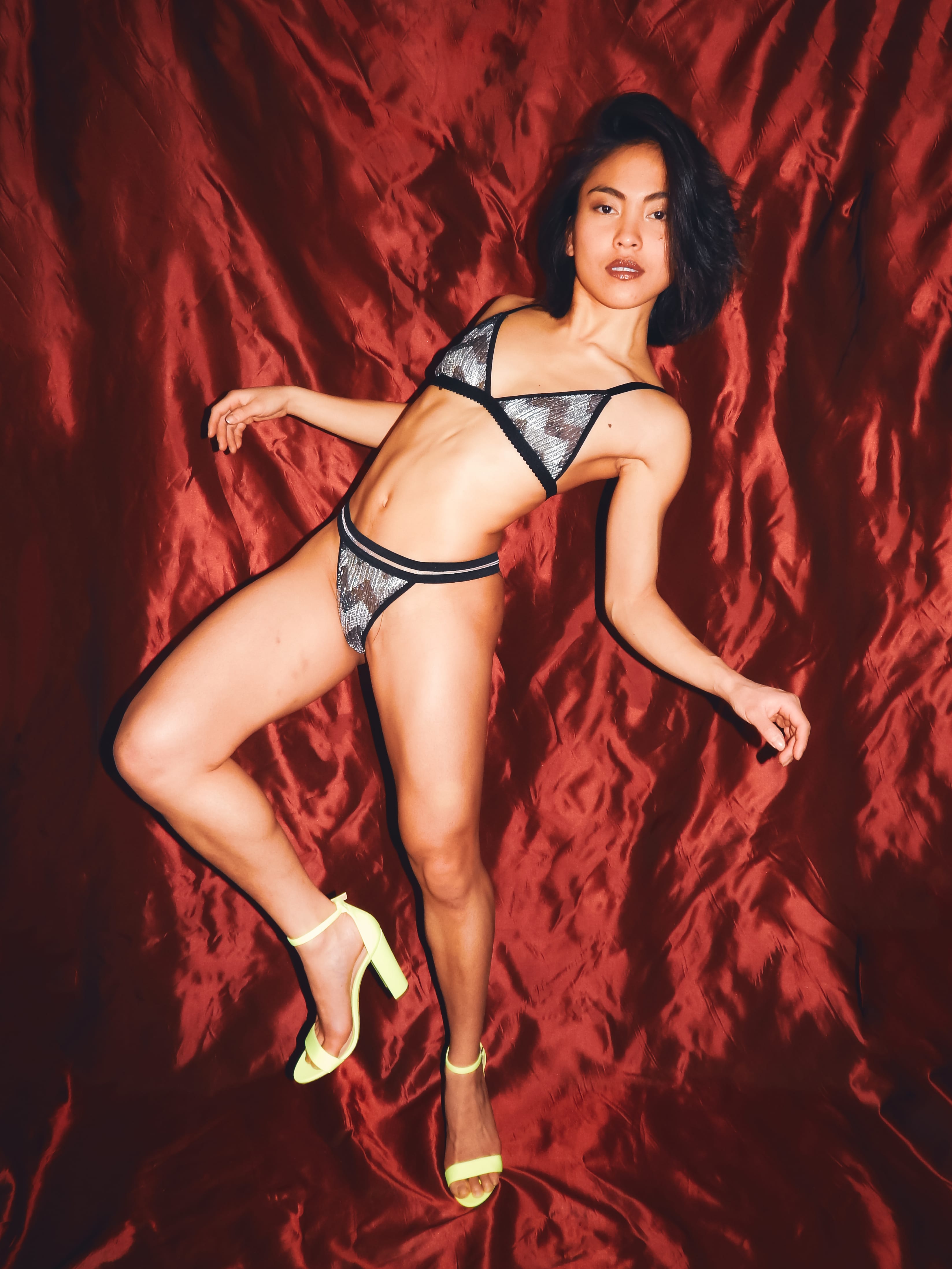 woman wearing a silver print underwear set while dancing 